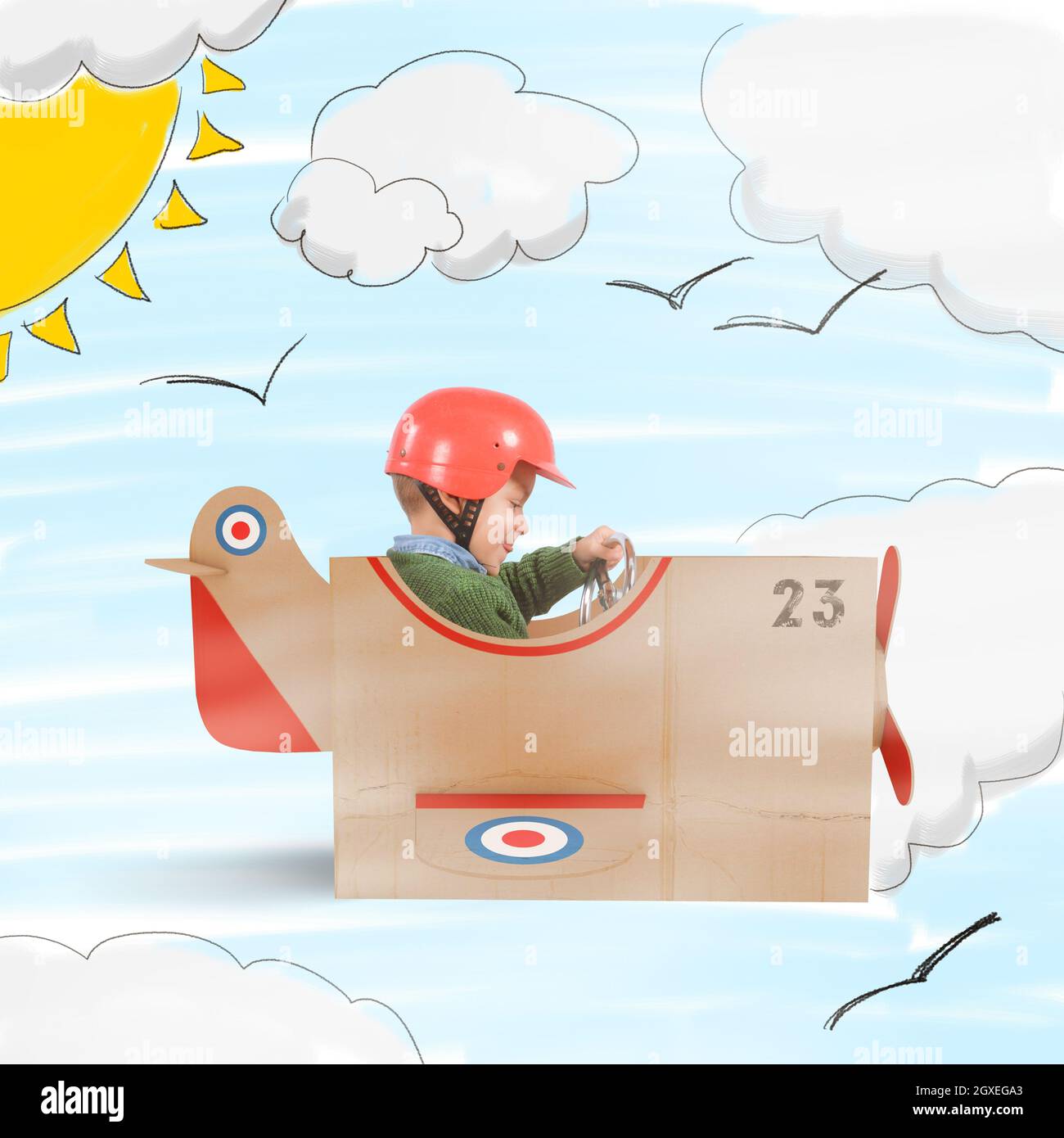 Child flies with his plane of cardboard Stock Photo Alamy