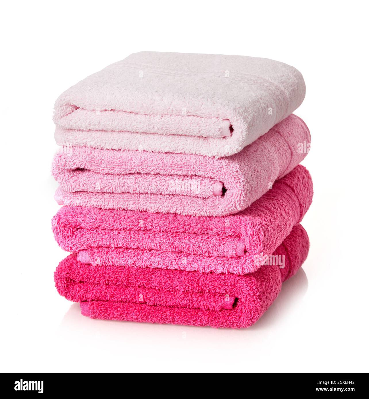 Pink towels stack on white background Stock Photo