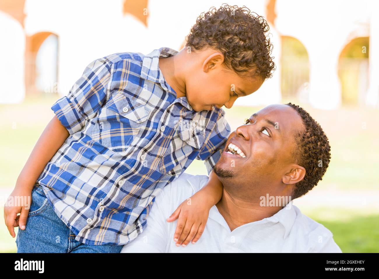 Happy African American Father and Mixed Race Son Playing in the Park ...