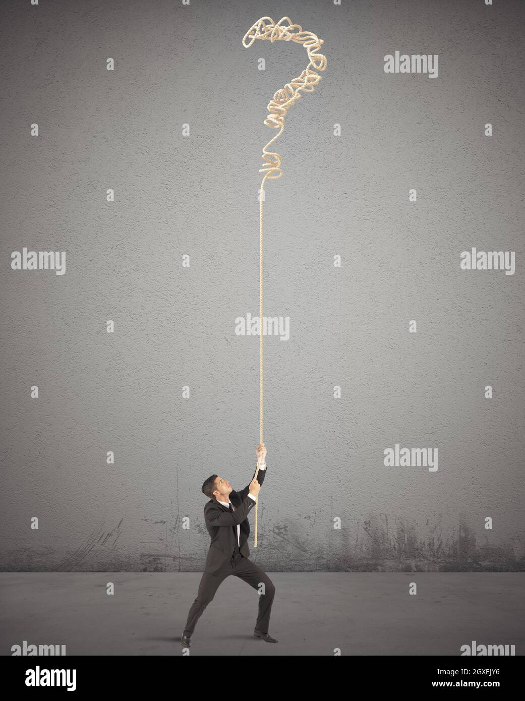 Businessman trying to solve the complicated tangle Stock Photo - Alamy