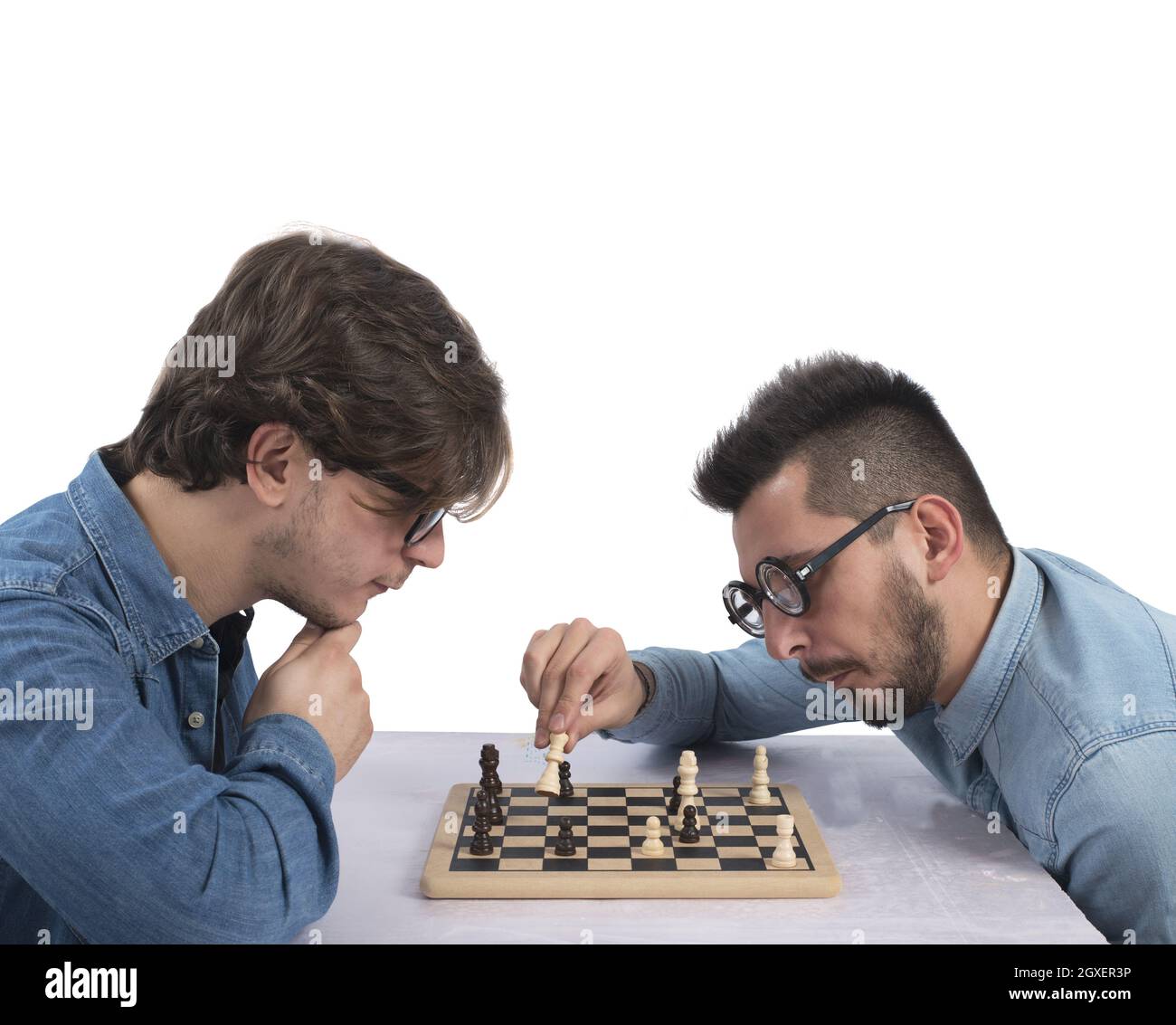Two brothers play and compete in chess Stock Photo