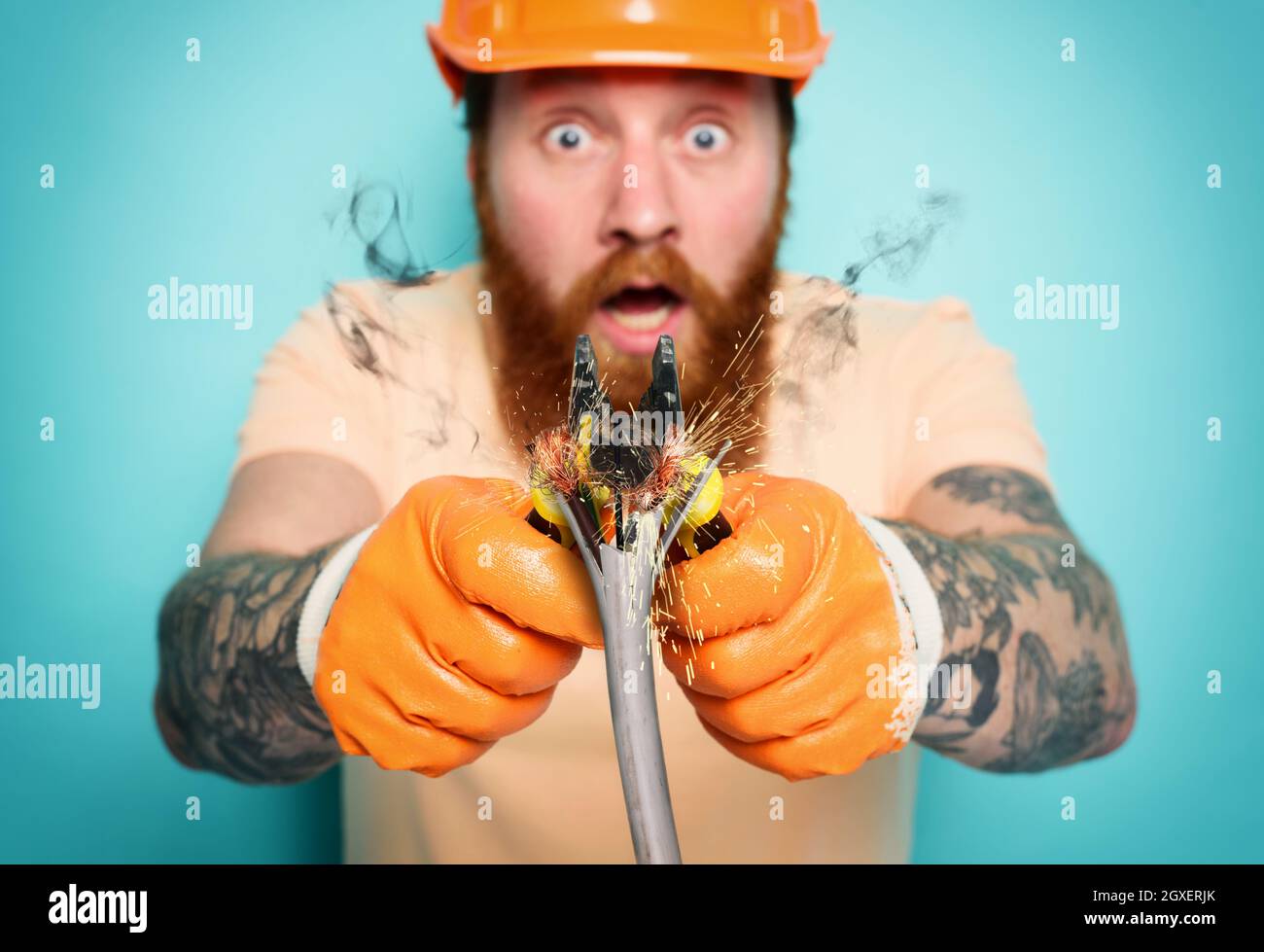 Incompetent worker electrician is unsure about his work Stock Photo