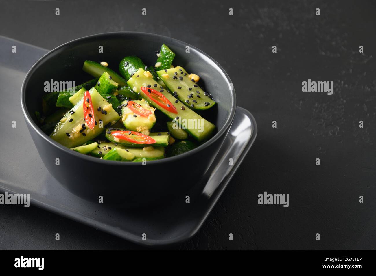 Asian spicy broken Cucumber salad with fresh coriander, ginger, pepper