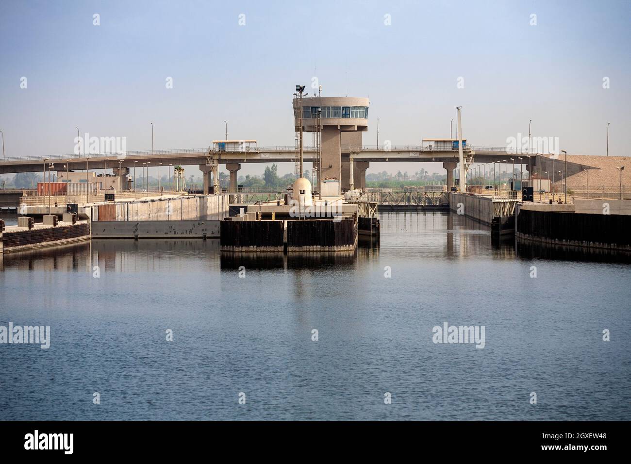 Two empty lock bays with control tower on the river Nile, Egypt Stock Photo