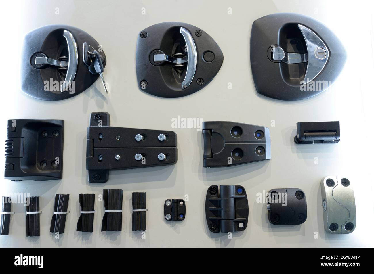 car door locks keys, door hinges and other door hardware placed on