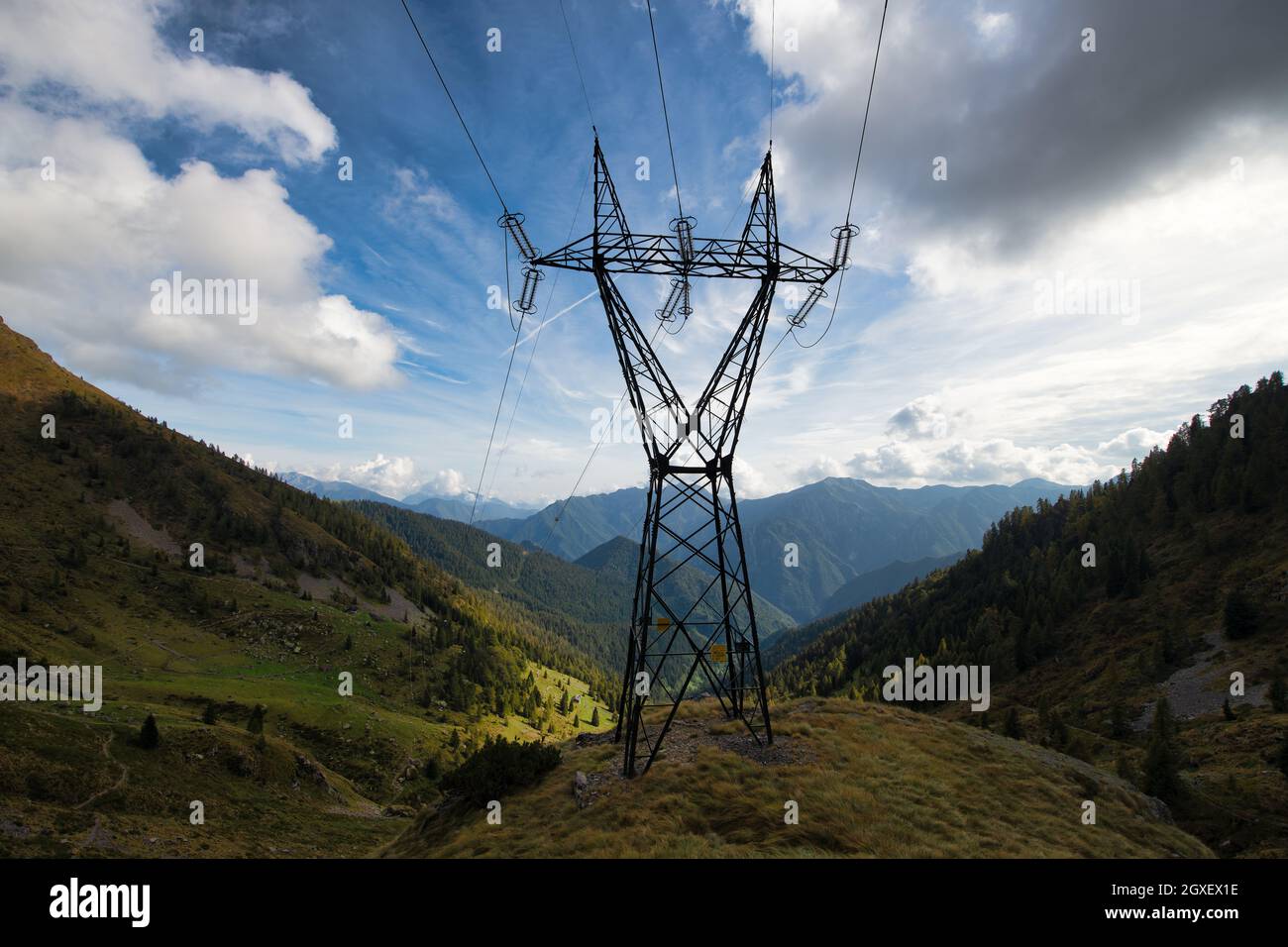 High voltage pylon in the mountains Stock Photo - Alamy