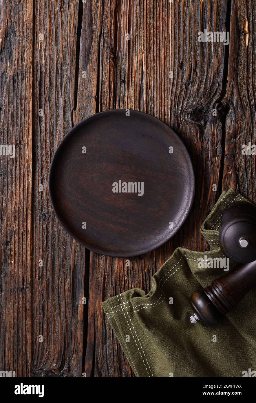 Empty plate on wooden table Stock Photo