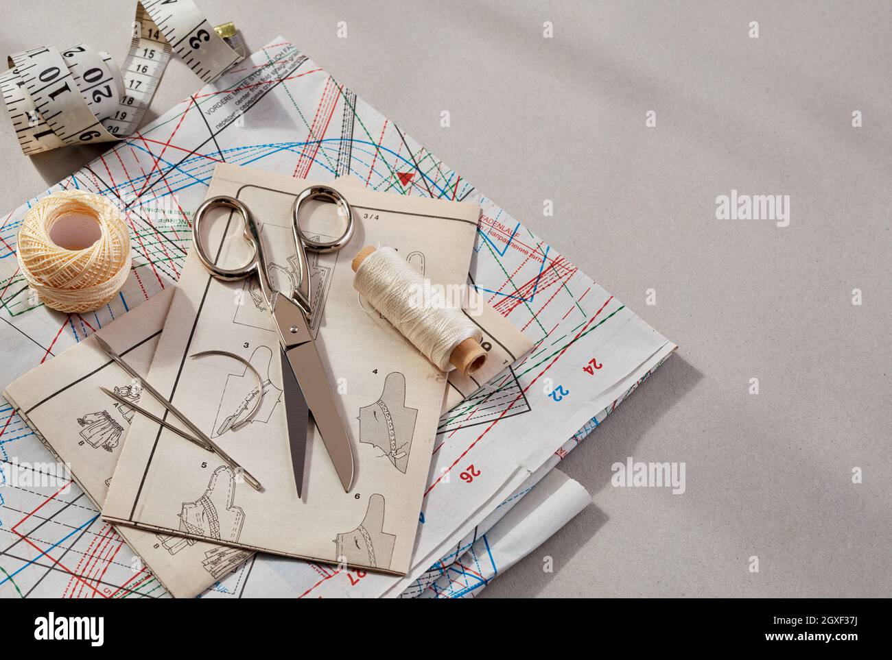 Accessories for sewing - fabric, pins, thread, buttons, top view Stock Photo