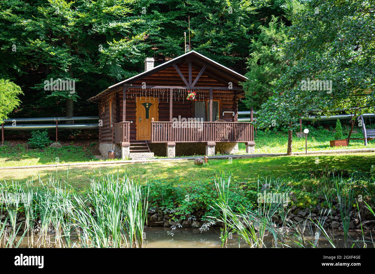 Cozy wooden house in the woods. Stock Photo