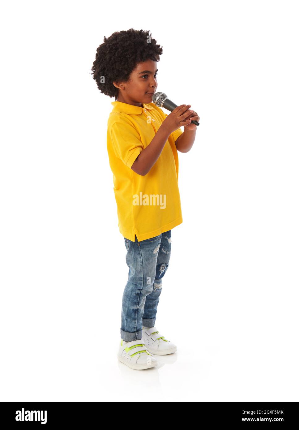 Afican-american kid with microphone on white background Stock Photo