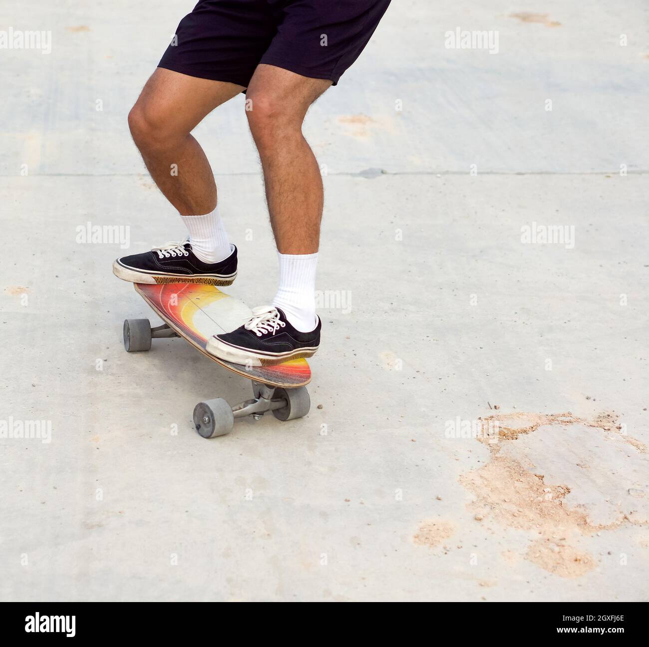 Skateboarding on road surface with dirt and sand. Can cause an accident