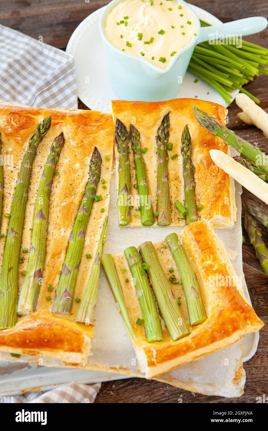 Savory puff pastry quiche with green asparagus Stock Photo Alamy