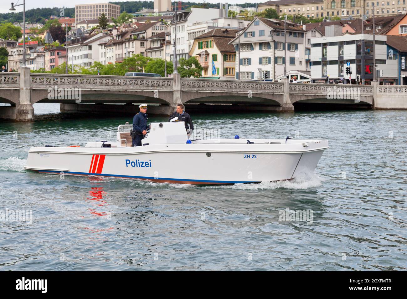 Zurich, Switzerland - June 12 2018: Two police officers navigating on the Limmat river. Stock Photo