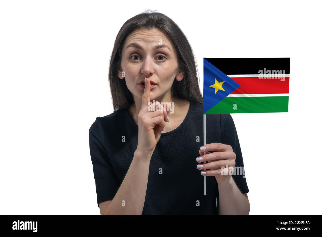 Happy young white woman holding flag of South Sudan and holds a finger ...
