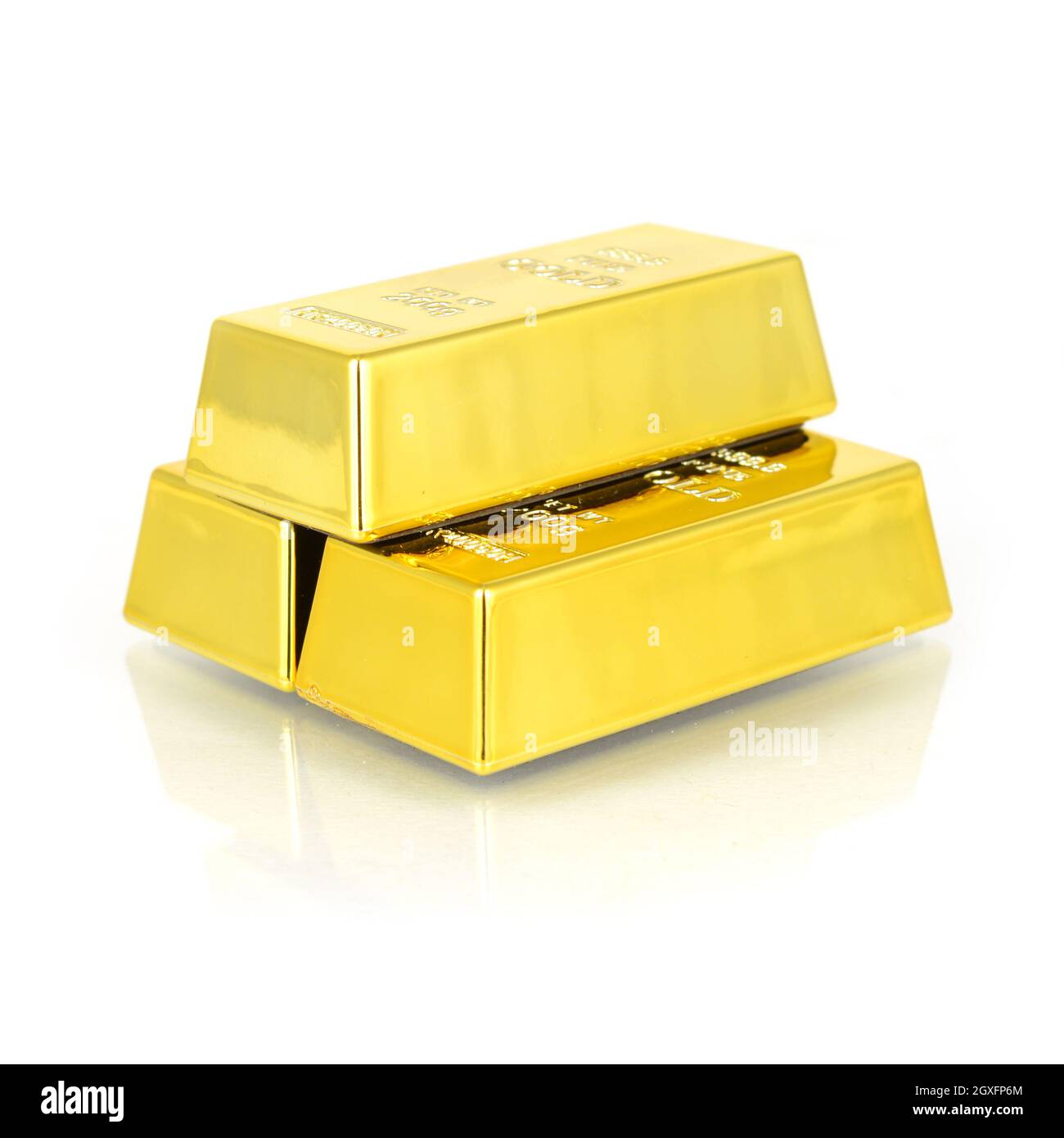A stack of pure Gold bullion bars isolated over clean white with a small reflection in the surface. Stock Photo