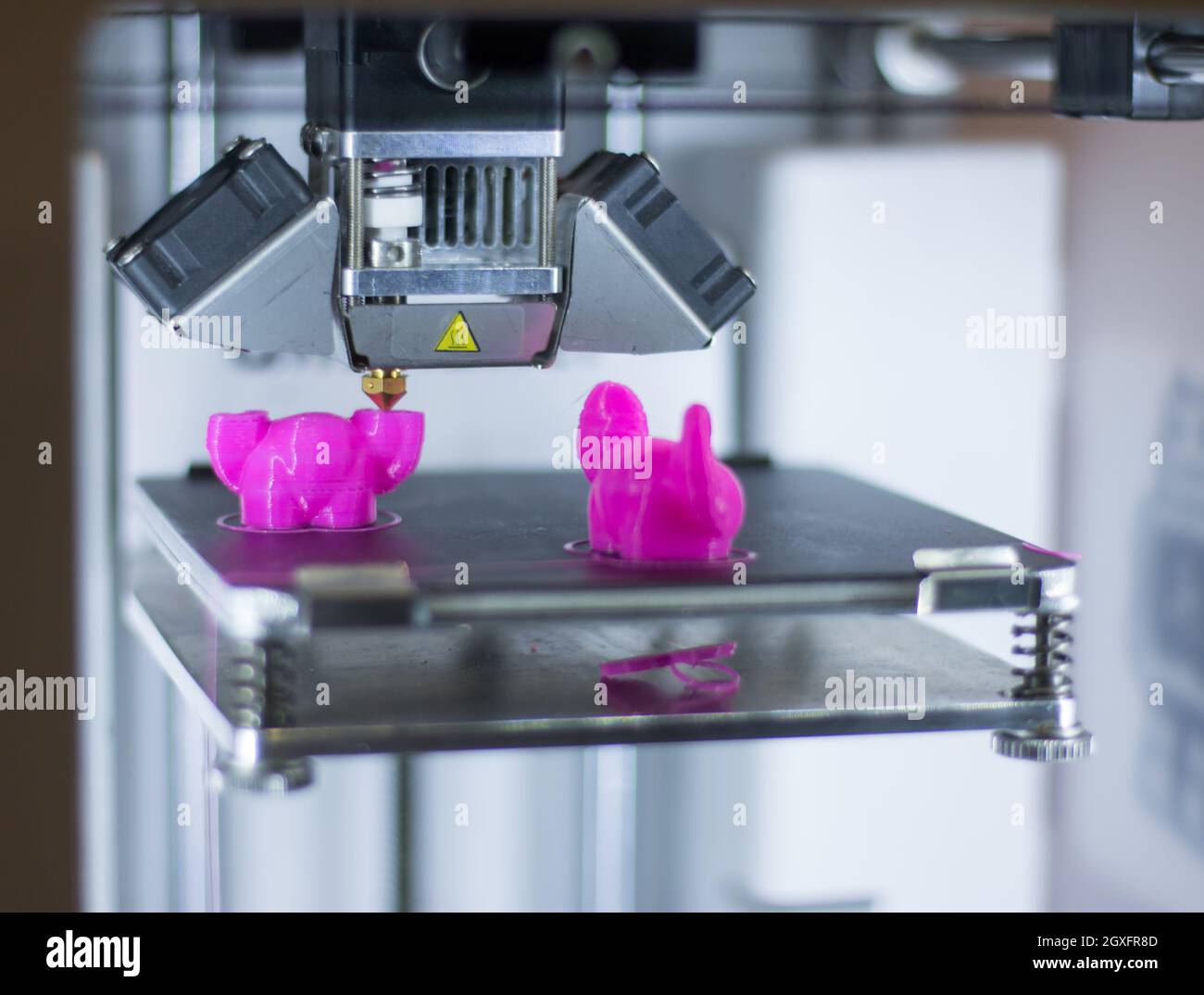 Automatic 3d printer performs a three-dimensional product creation, close-up Stock Photo