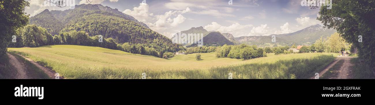Panorama of mountains, sky and meadow in Bavaria near Bad Reichenhall, Germany Stock Photo