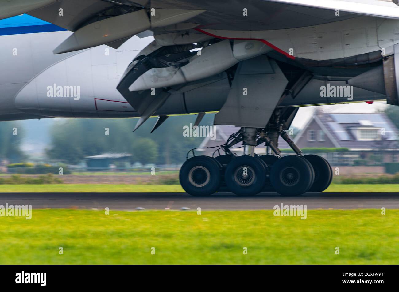Passenger aircraft landing gear during landing Stock Photo