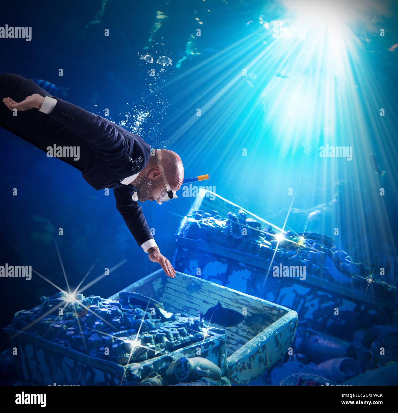 Man finds trunks with treasures under water Stock Photo