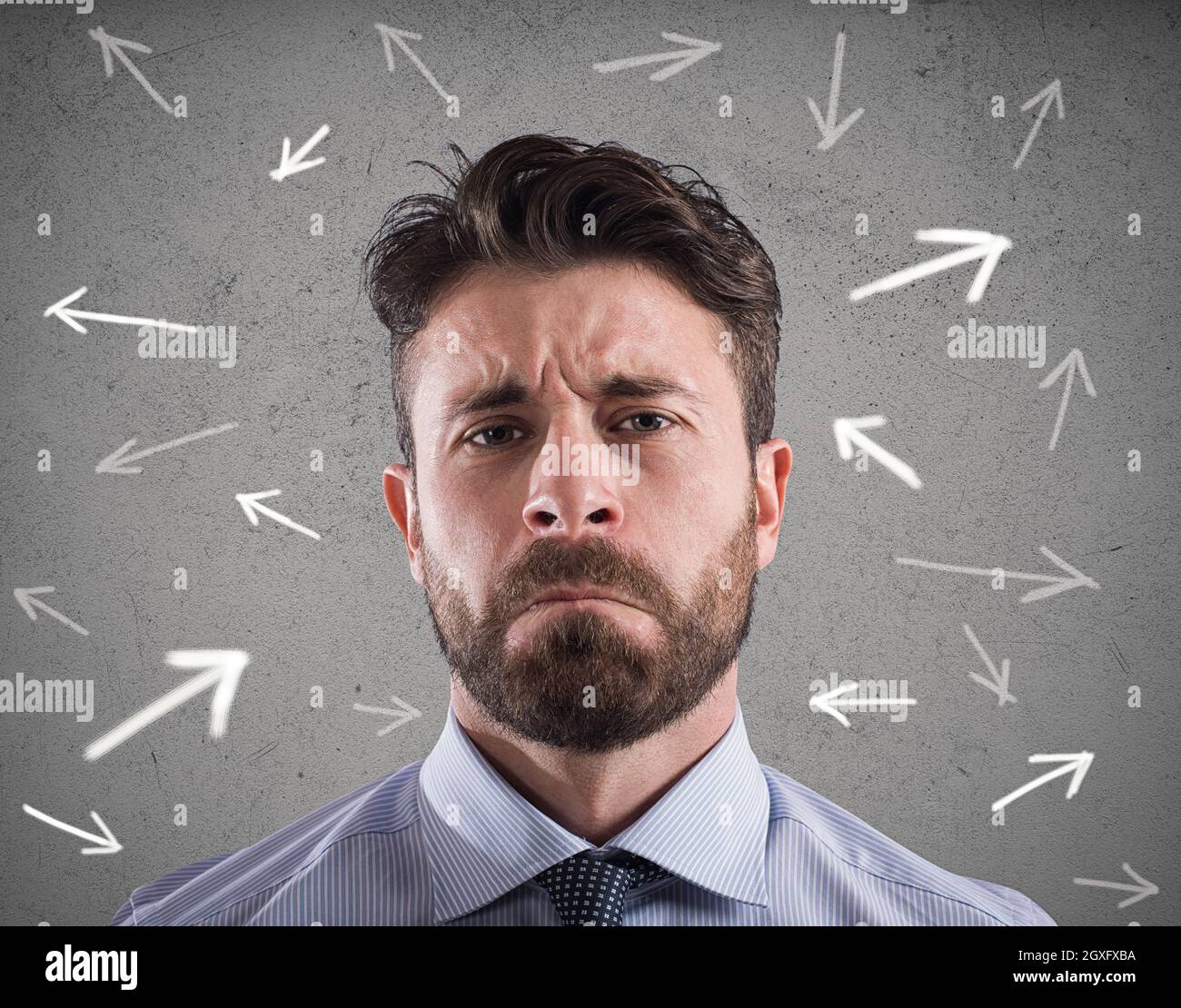 Confused businessman looking a wall with directional arrows. concept of confusion Stock Photo