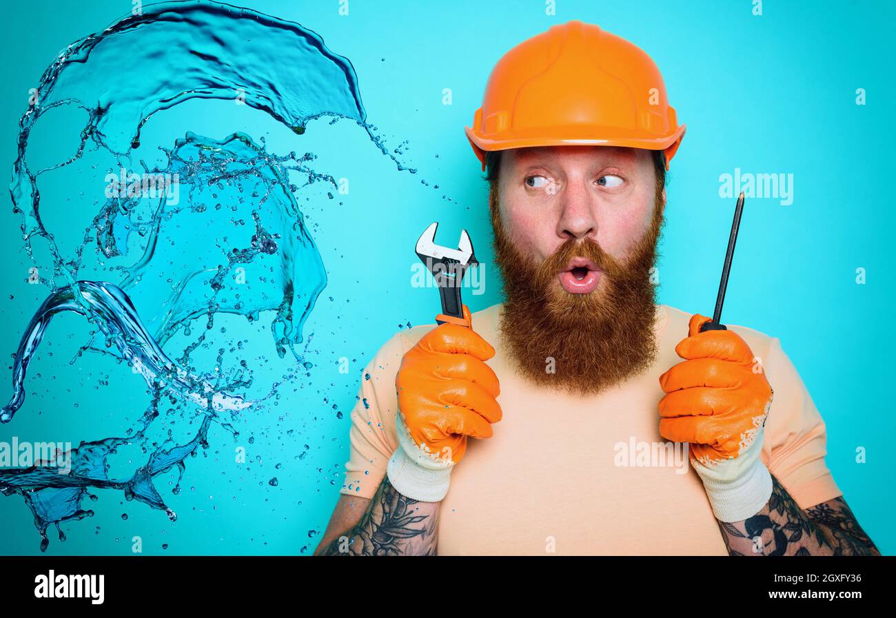 Incompetent worker plumber is unsure about his work Stock Photo