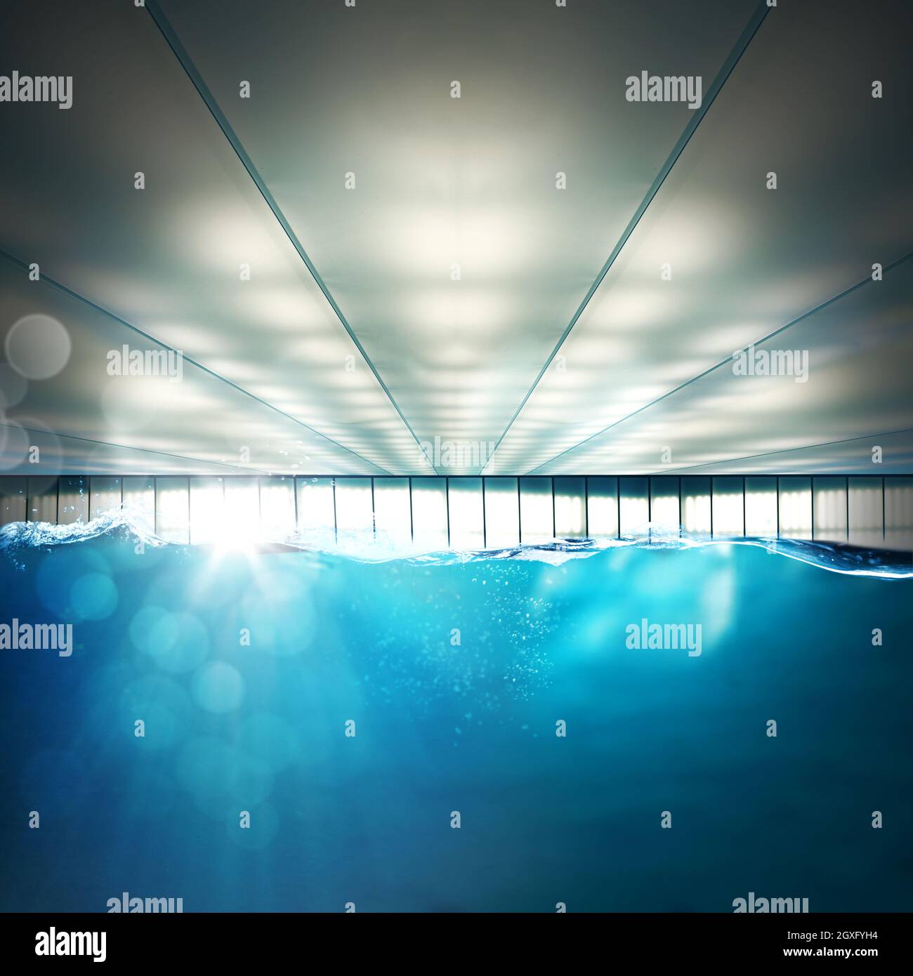 Indoor swimming pool with rays of light Stock Photo - Alamy