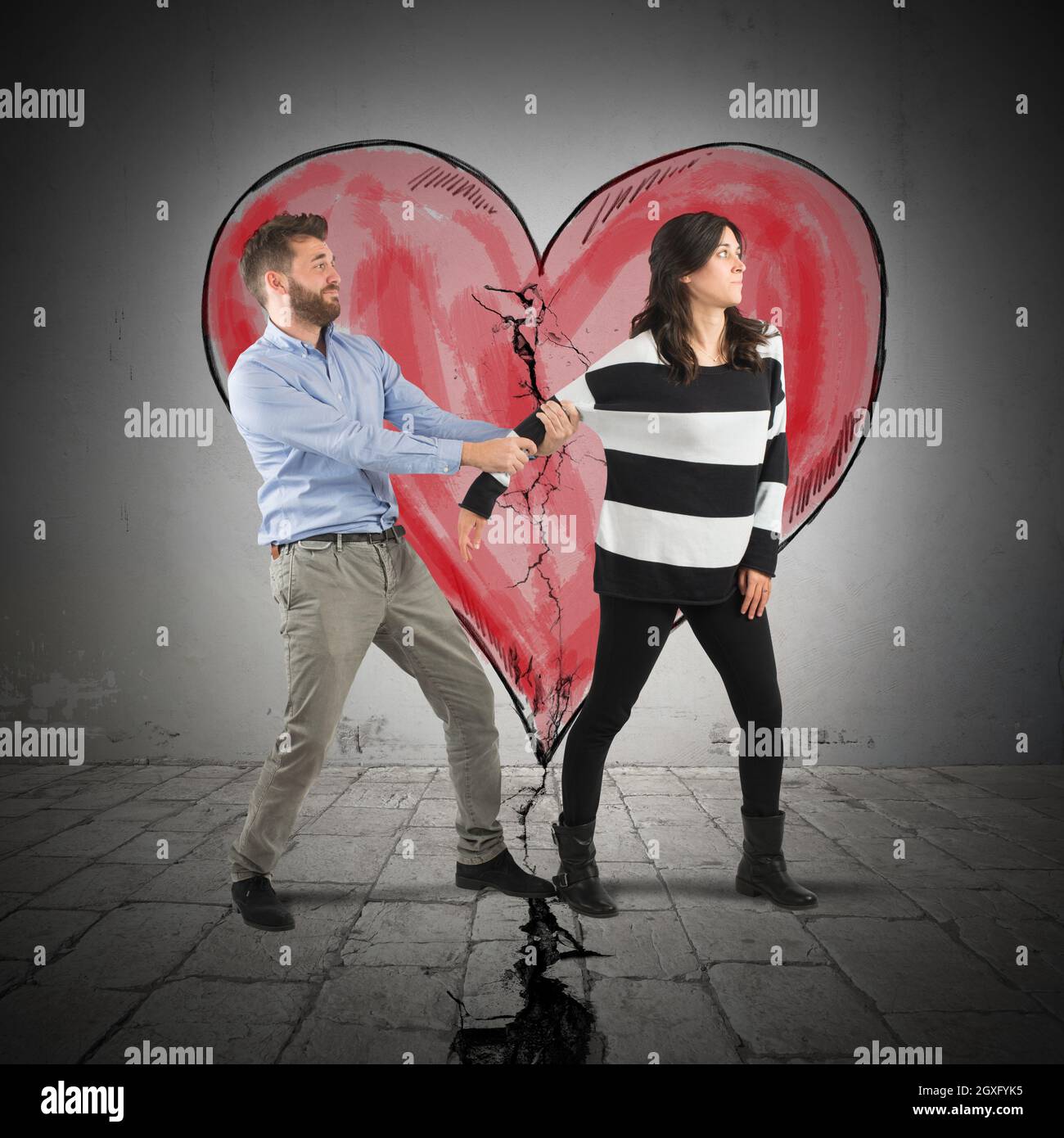 Boy pulling a girl with broken heart Stock Photo - Alamy