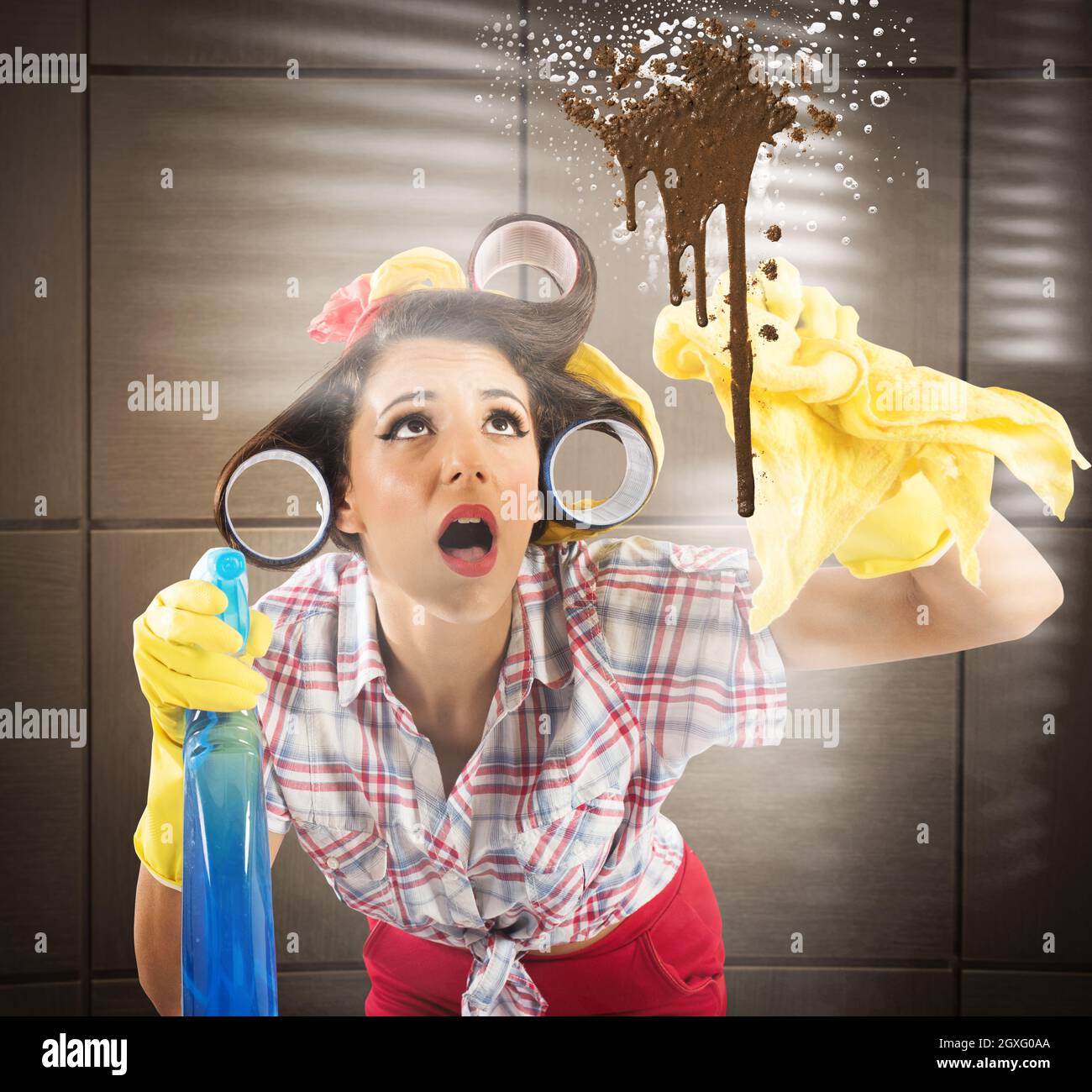 Housewife with spray cleaning a dirty glass Stock Photo Alamy
