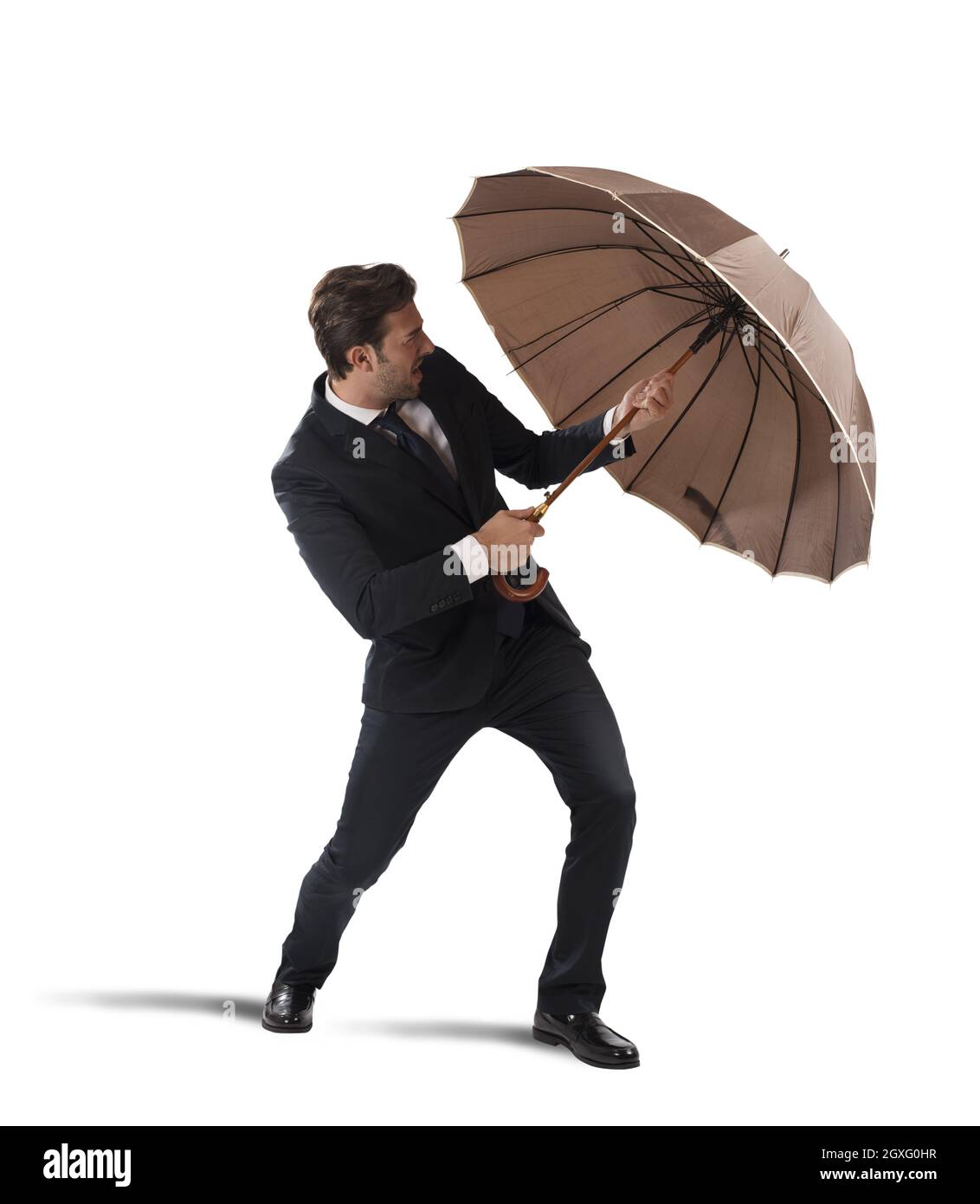 Businessman protect himself with umbrella on white background Stock ...