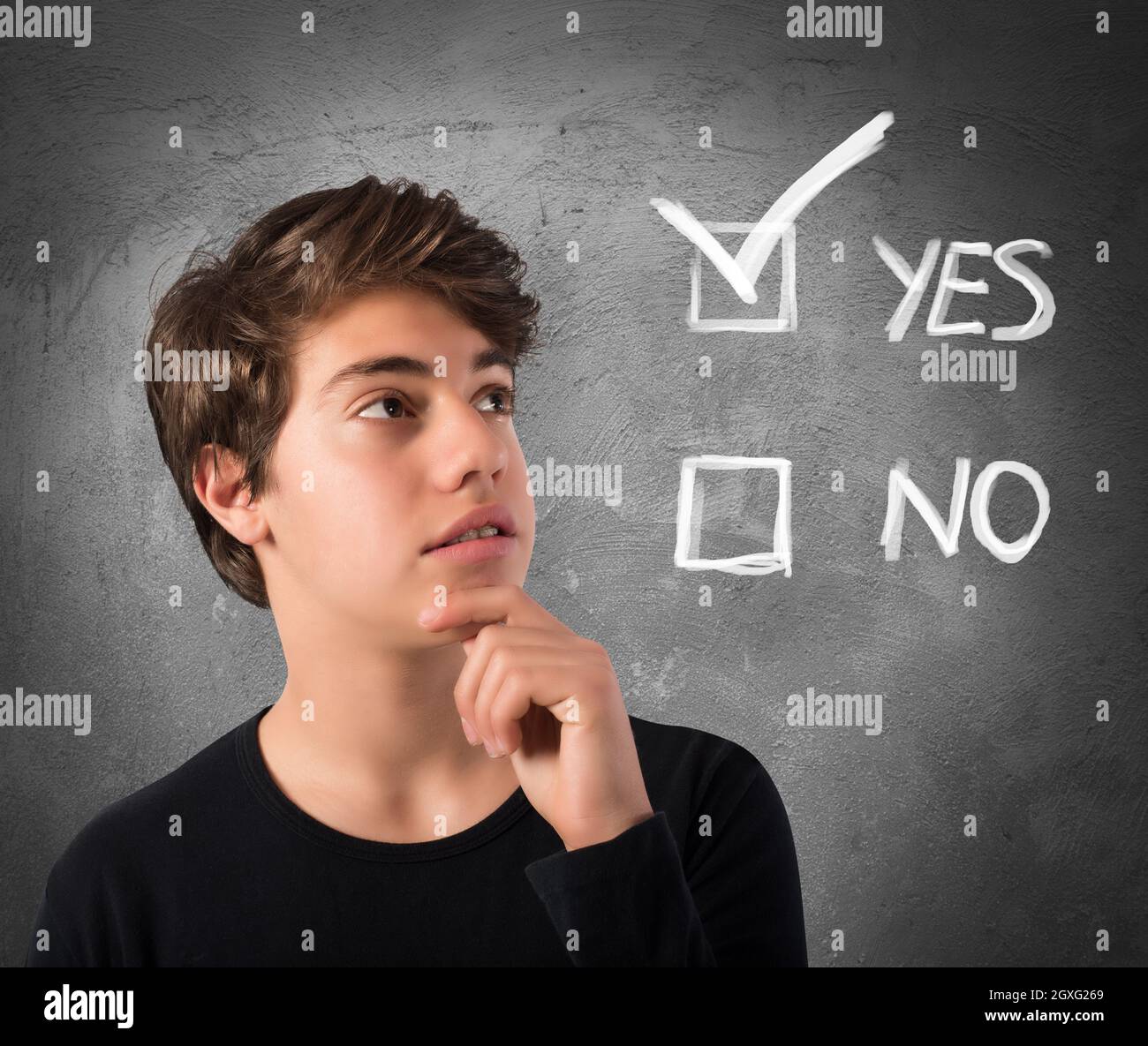 Teenage Boy with thoughtful expression and checkboxes Stock Photo - Alamy