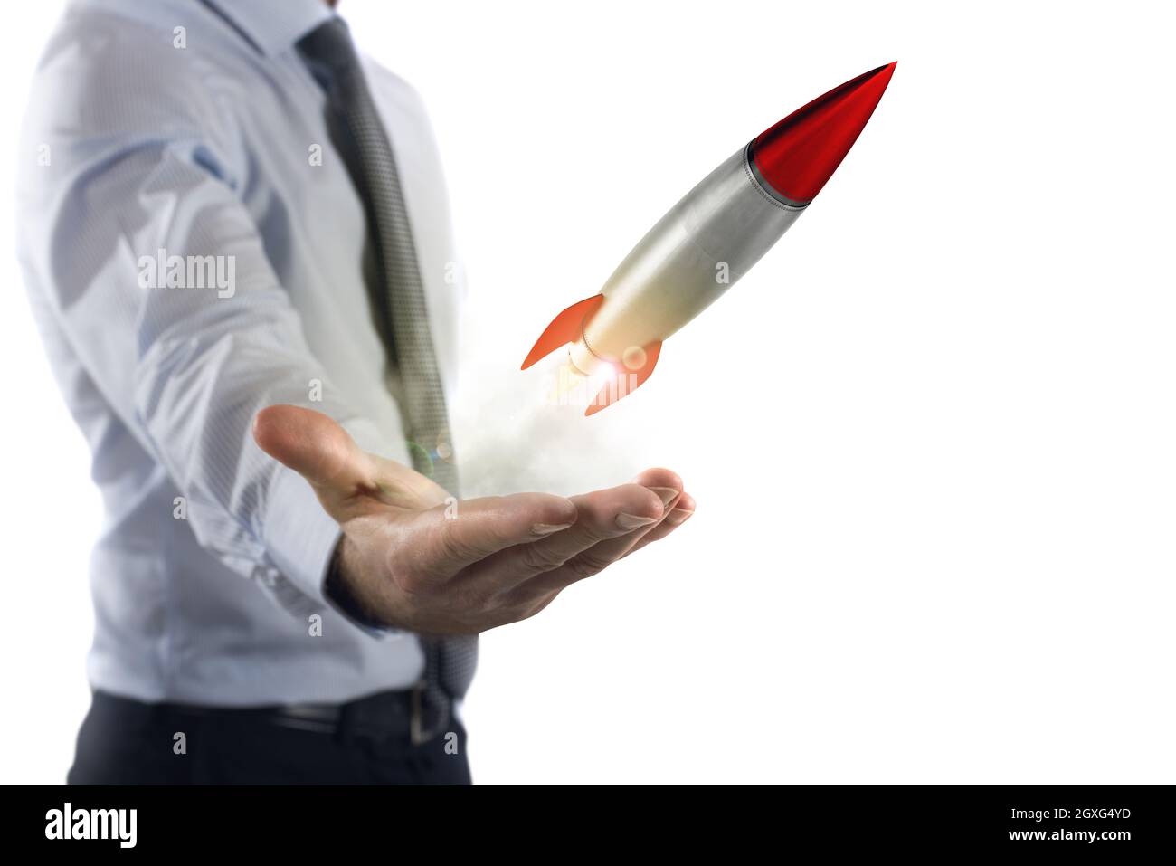 Businessman holding a small rocket. Startup working enterprise concept Stock Photo