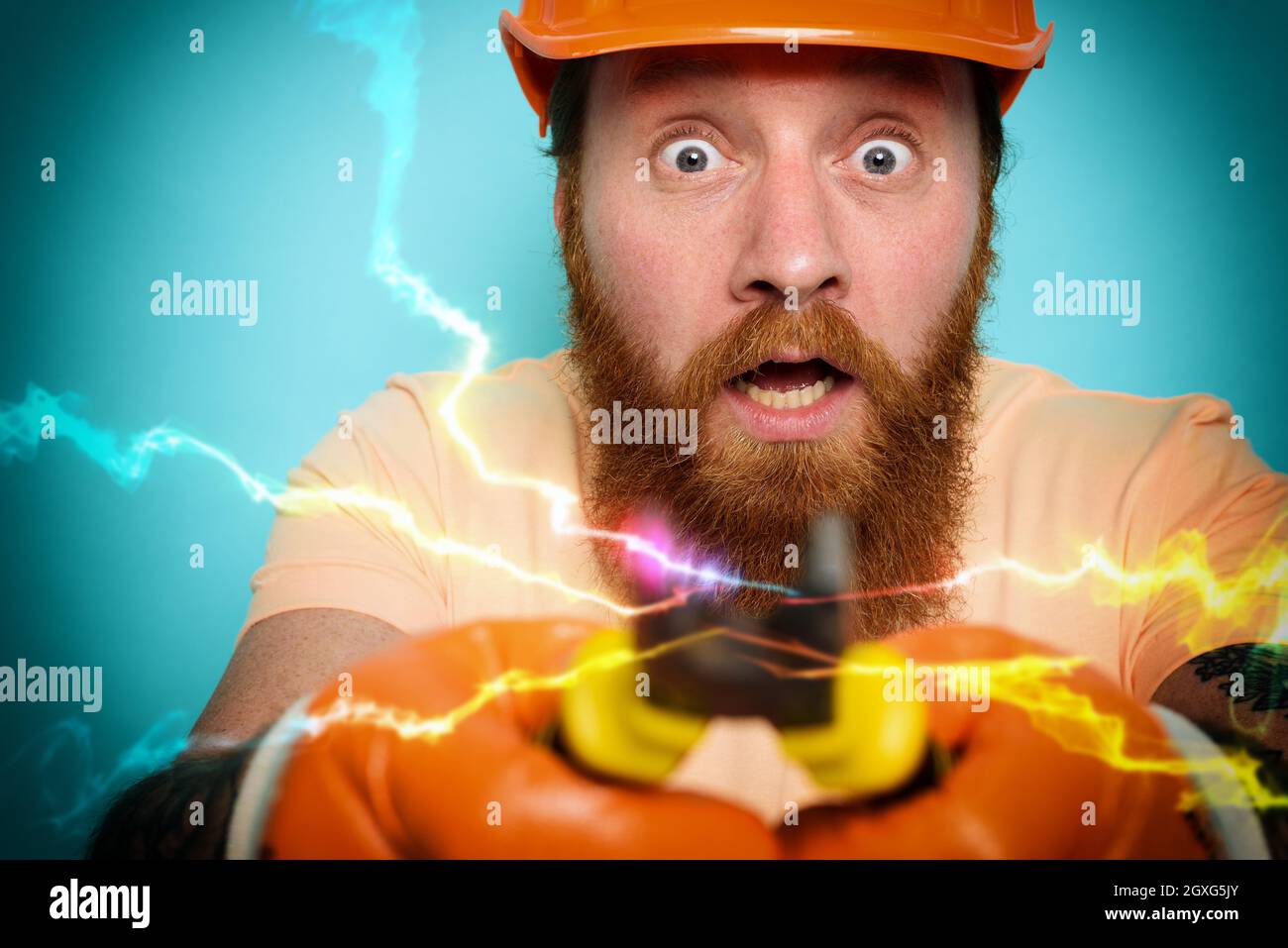 Incompetent worker electrician is unsure about his work Stock Photo