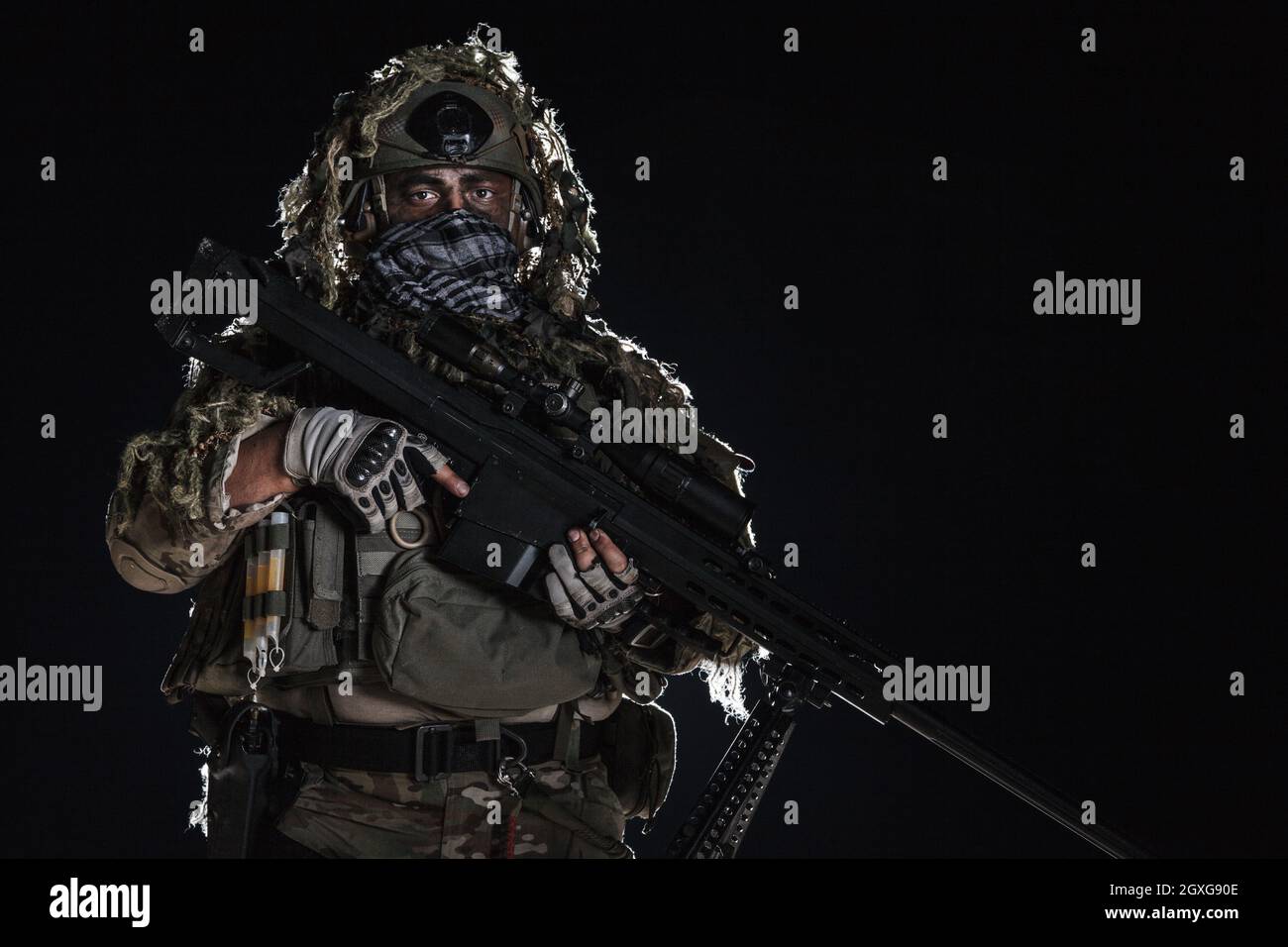 Army sniper with big rifle standing on black background. Face is painted  with warpaint. Backlit contour silhouette shot Stock Photo - Alamy