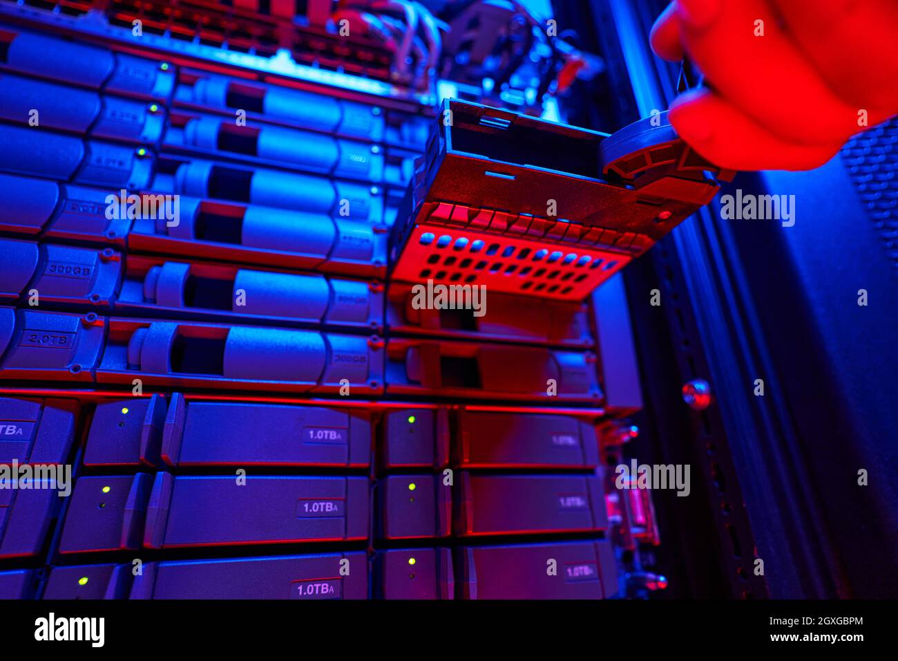 It engineer is disassembling and repairing computer server in data center Stock Photo