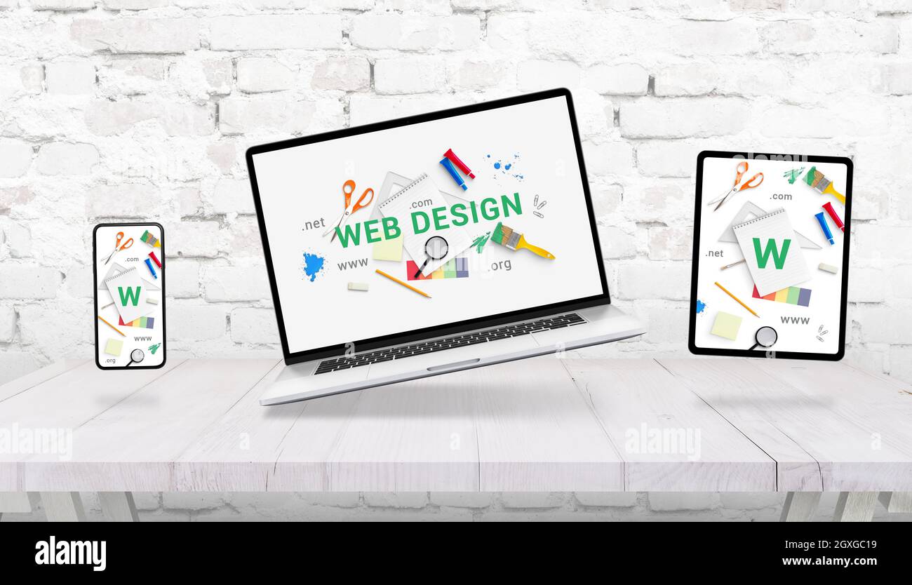 Responsive web design composition with levitating laptop, tablet and phone above the desk Stock Photo