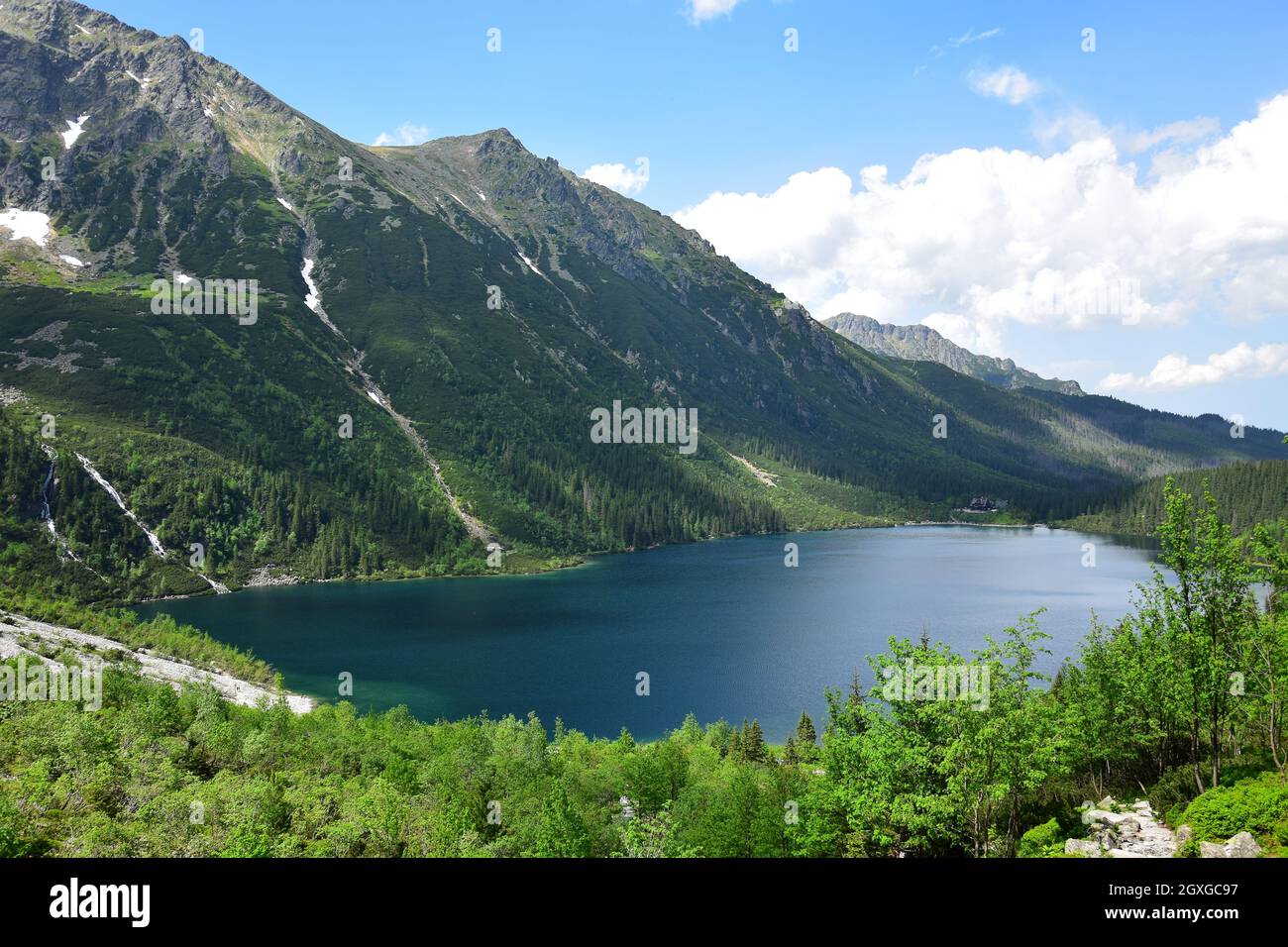 The beautiful Morskie oko, also called, Eye of the Sea, surrounded by the Tatra mountains. View from the lake above, Czarny staw pod rysami. Poland. Stock Photo