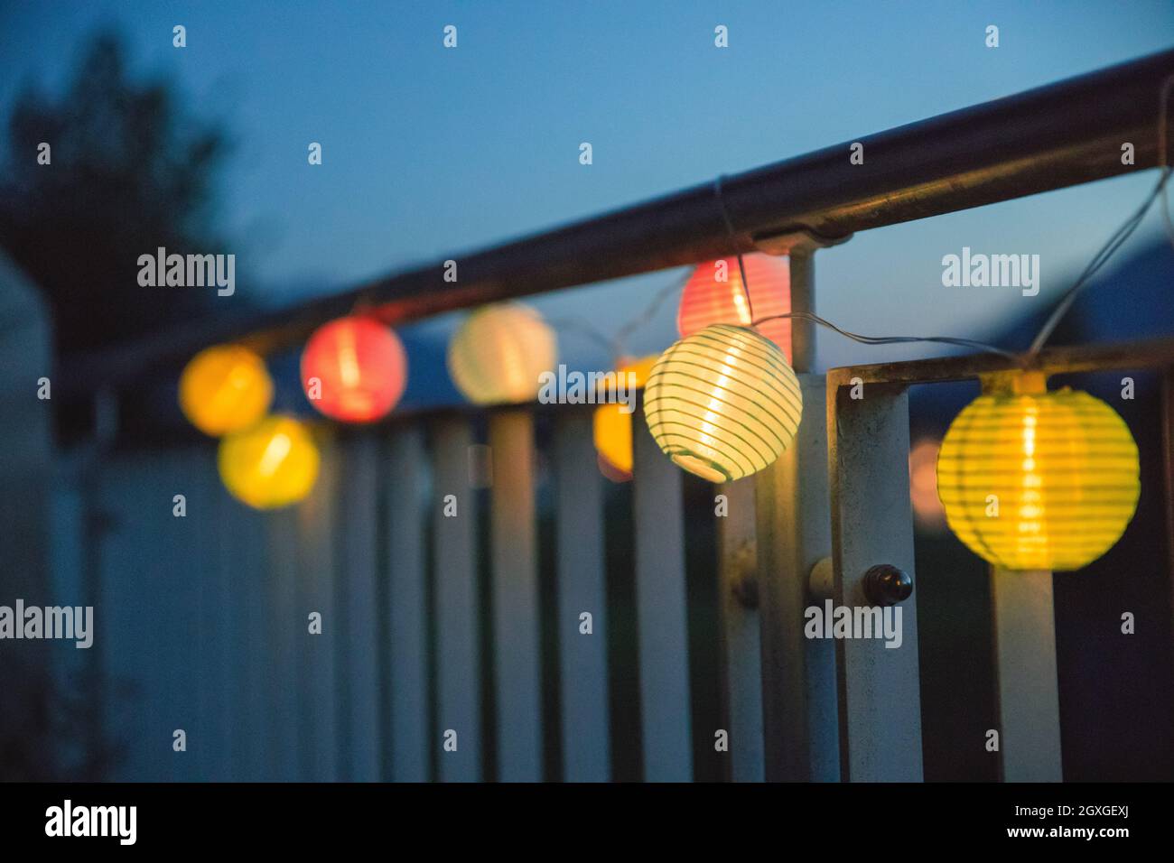 Colorful lampions outside, twilight hour, garden party Stock Photo Alamy