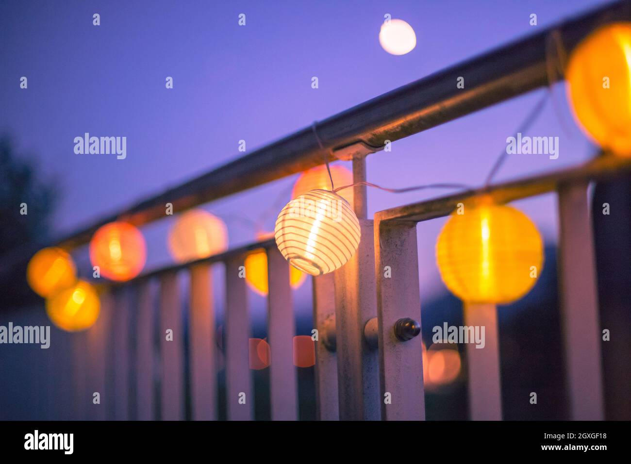 Colorful lampions outside, twilight hour, garden party Stock Photo Alamy