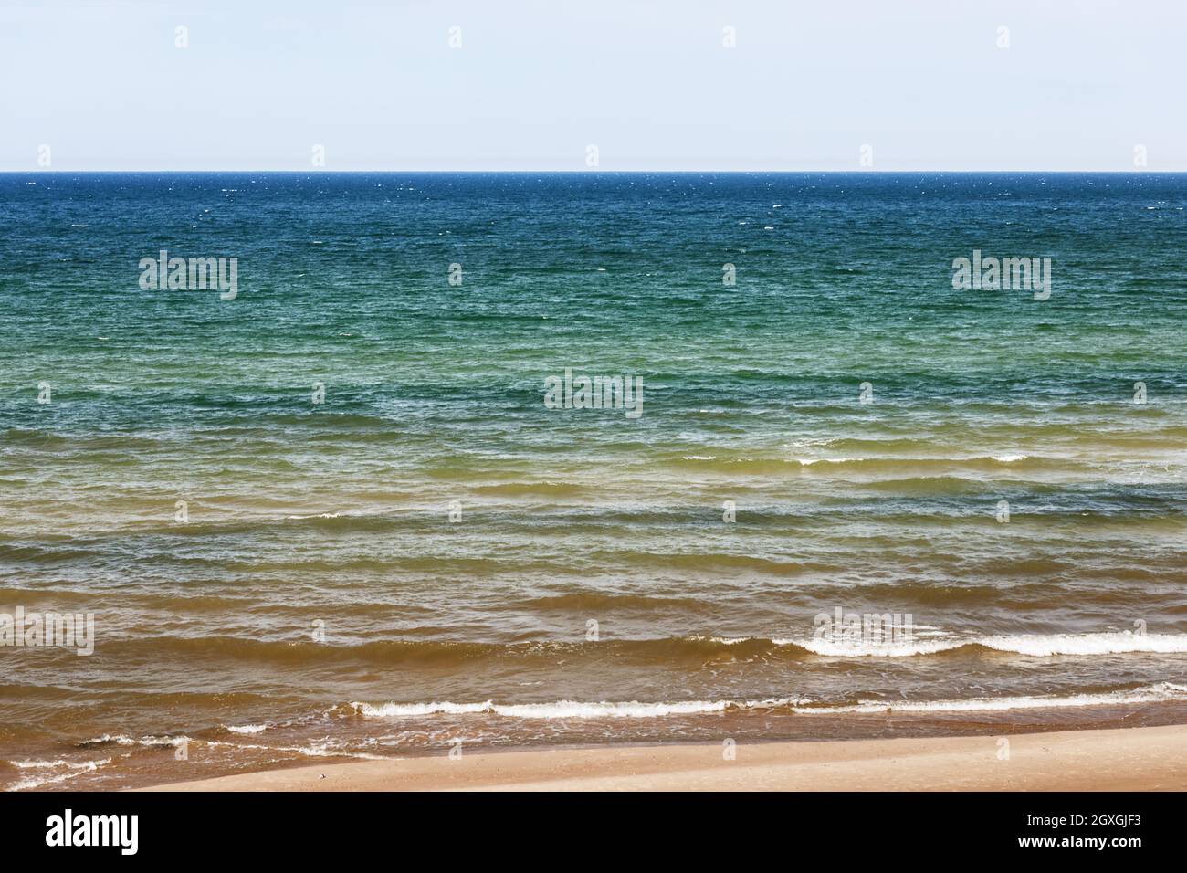 The sea surface of the baltic sea with multicolored color transitions ...