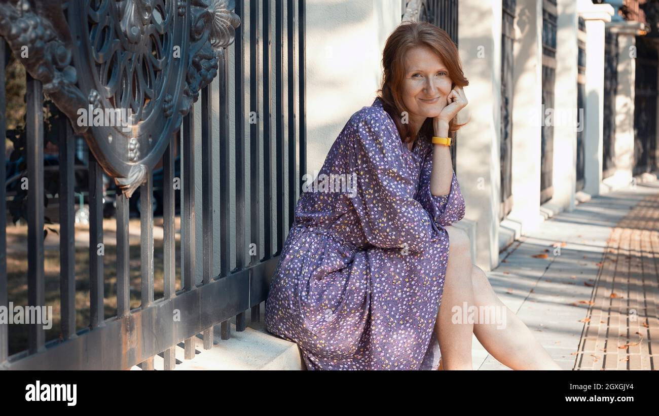 Beautiful girl sits in autumn hi-res stock photography and images - Alamy