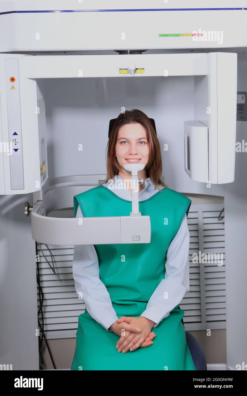 Xray equipment in a dental clinic. The patient takes a panoramic