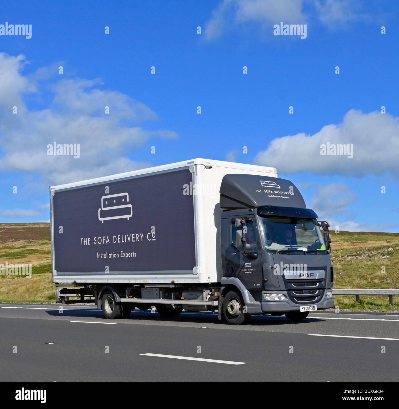 Goods Vehicle. The Sofa Delivery Company Limited. Installation experts.  M6 Motorway, Southbound. Shap, Cumbria, England, United Kingdom, Europe. Stock Photo