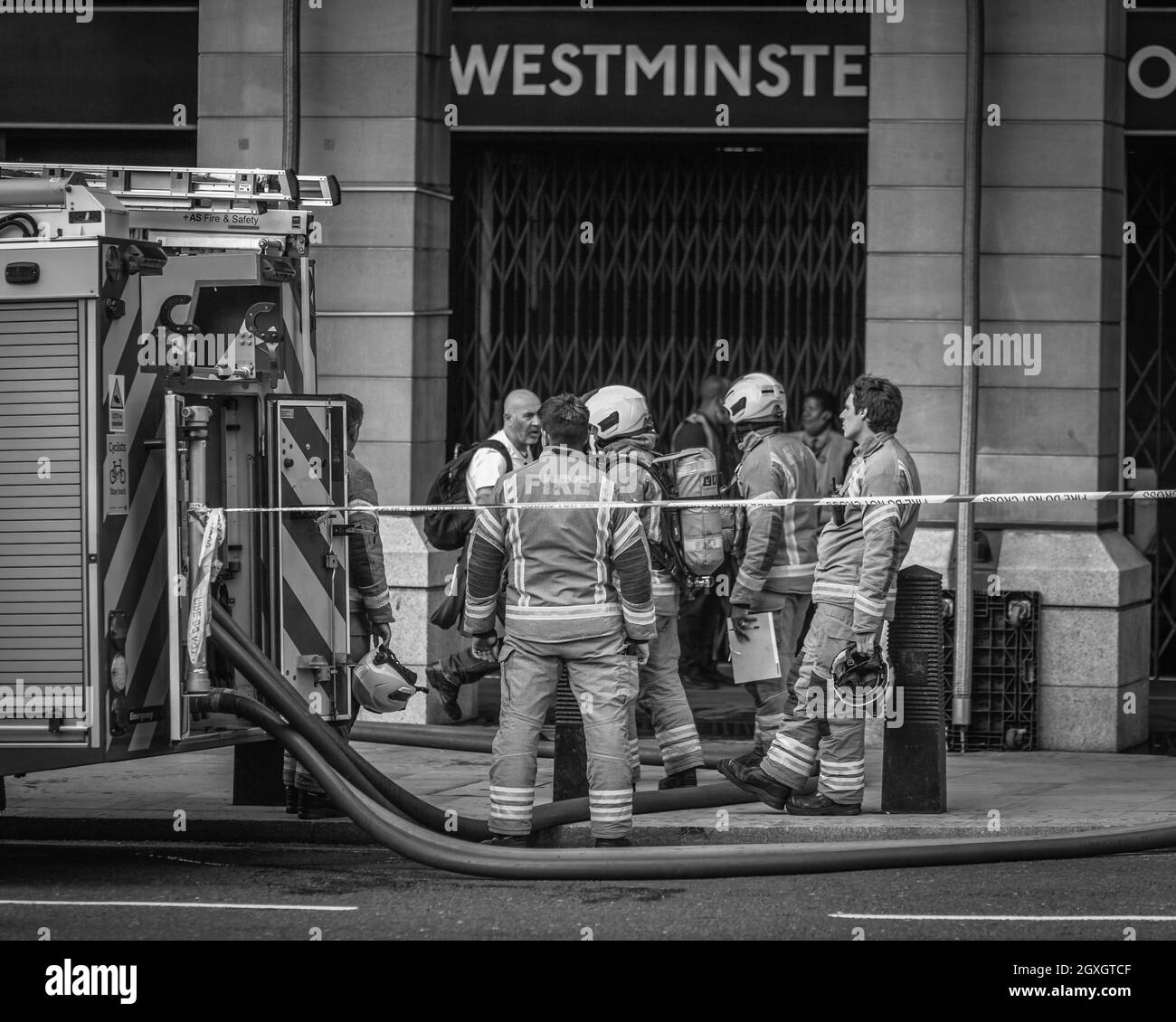 Fire Fighters discuss tactics on how to tackle the fire at Westminster Tube Station. Stock Photo