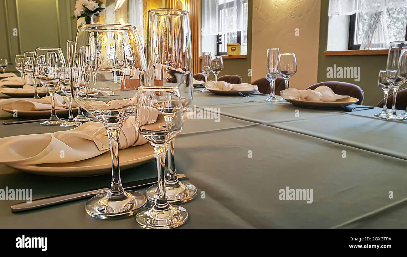Festive table setting in the restaurant. Wedding preparations. Selective focus. Copy space. Stock Photo