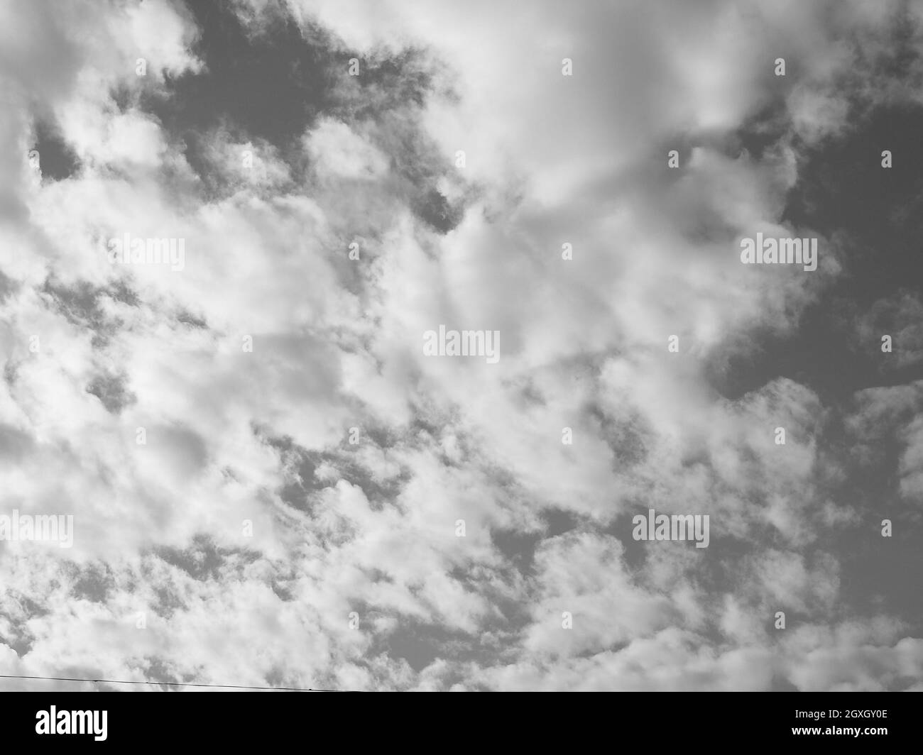 sky with clouds useful as a background in black and white Stock Photo ...