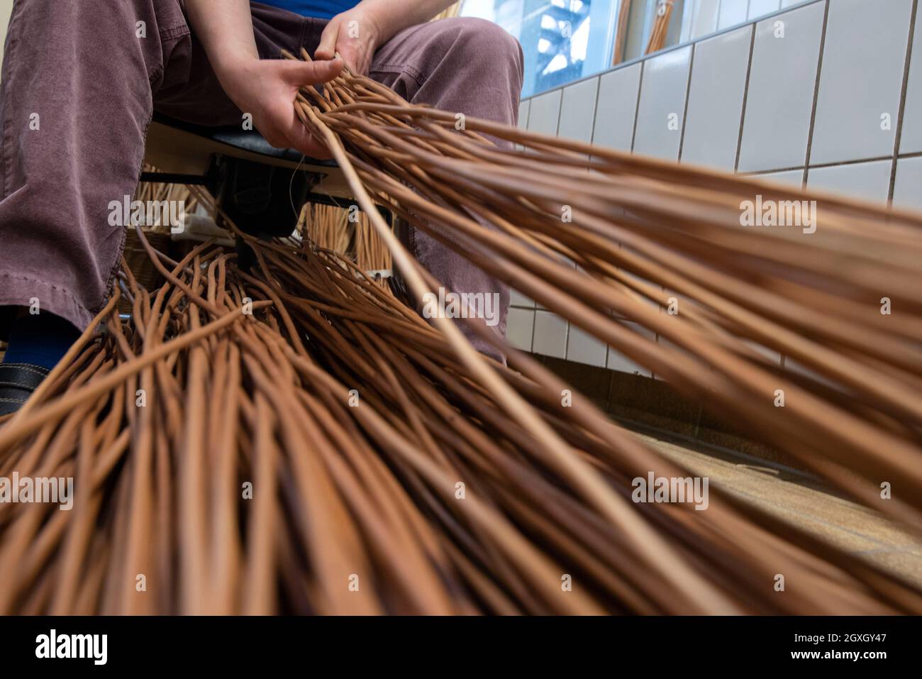 basket weaving in a sheltered workshop, work with disabled or handicapped people Stock Photo
