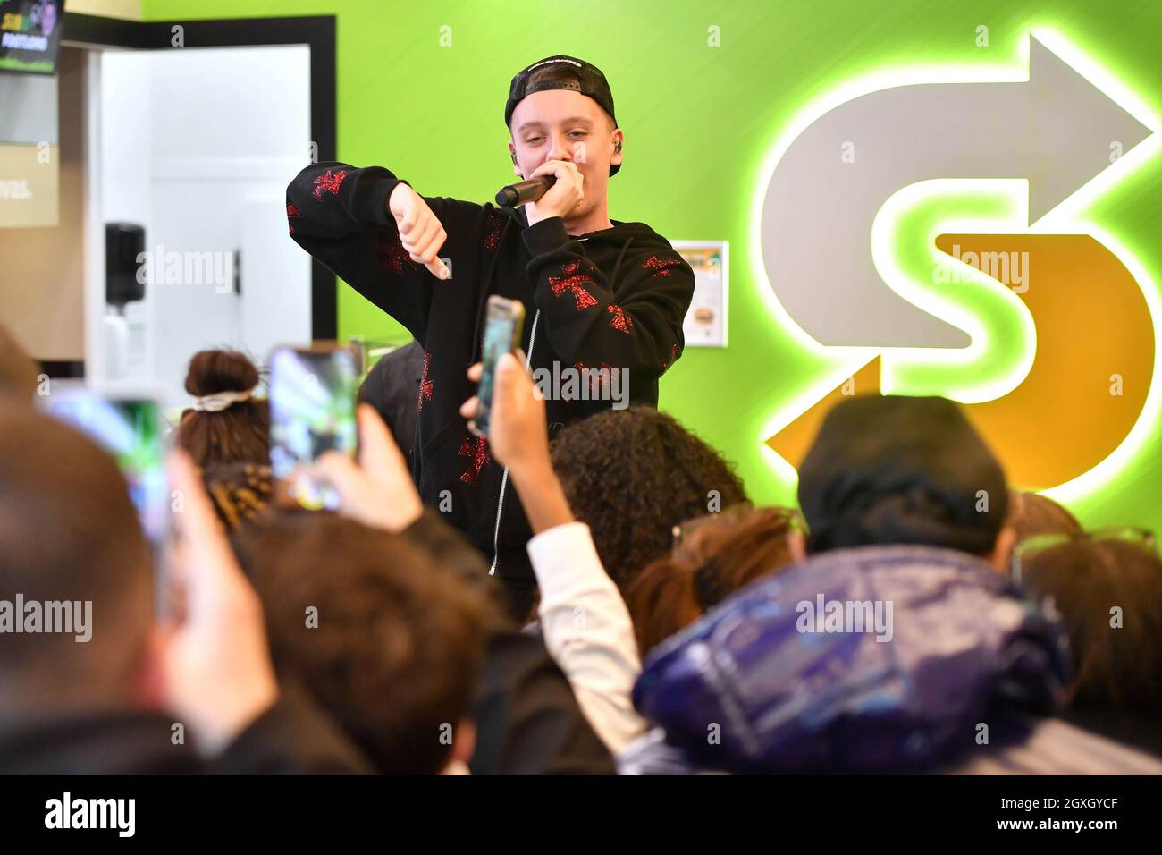 EDITORIAL USE ONLY Rapper Aitch giving a surprise performance of his new single 'Party Round My Place' for fans in his local Subway store in Manchester. Picture date: Tuesday October 5, 2021. Stock Photo