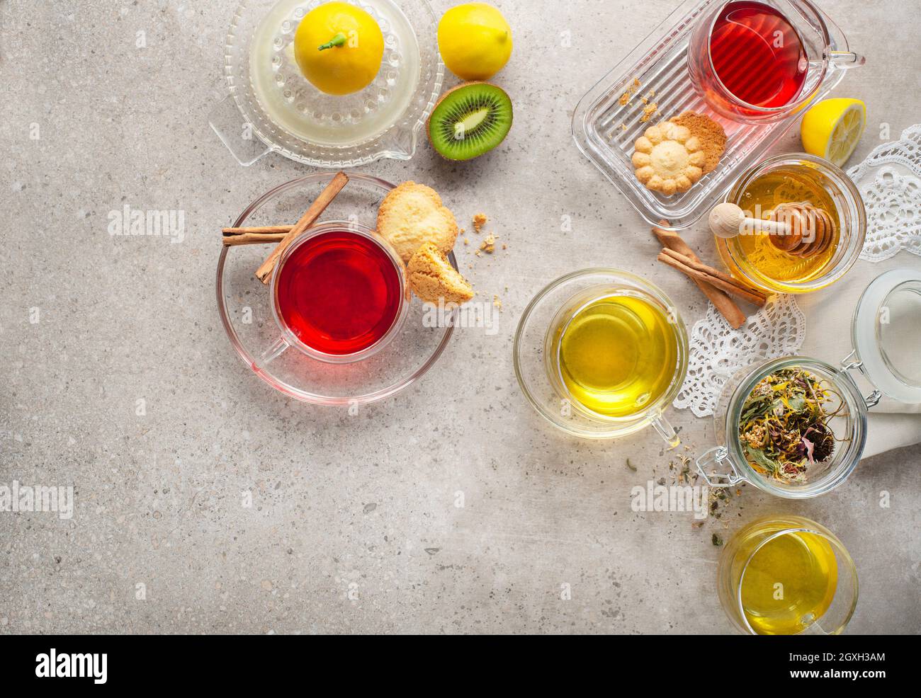 Herbal tea, green tea, fruit tea cups on grey background Stock Photo