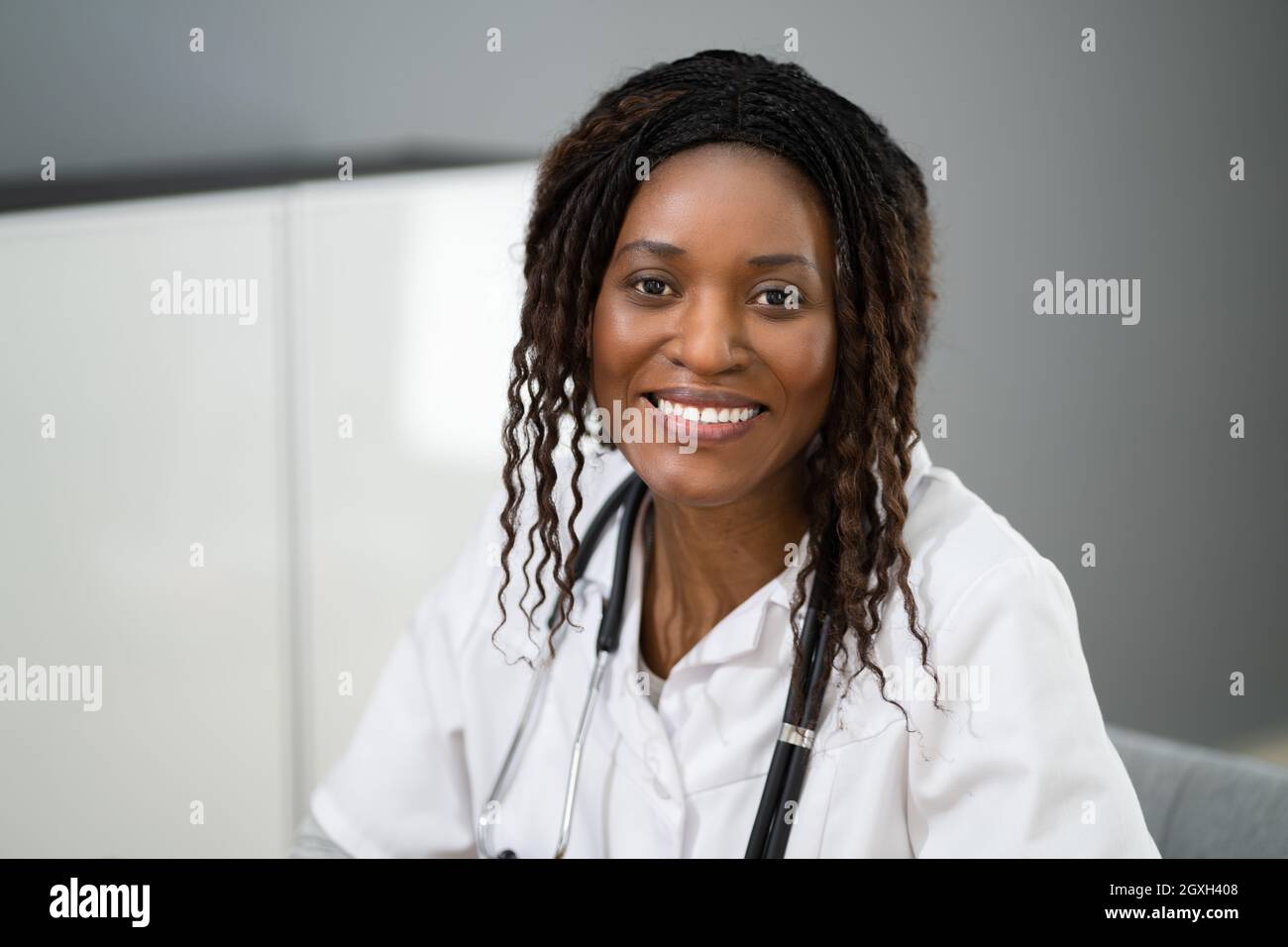 African American Doctor With Stethoscope At Healthcare Lab Stock Photo