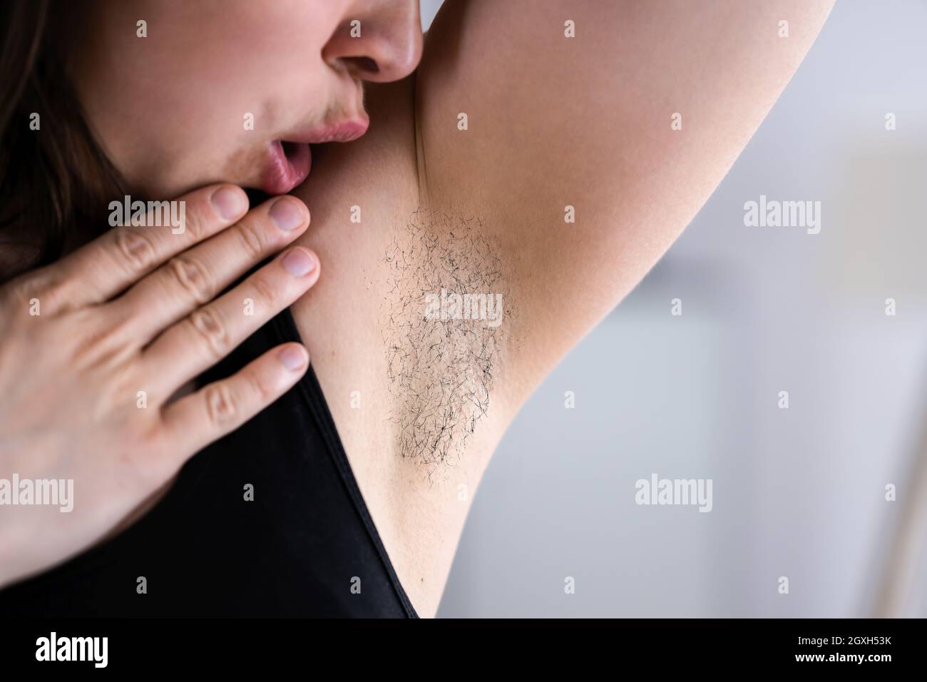 Hairy Woman Underarm. Women Armpit Hair And Body Care Stock Photo